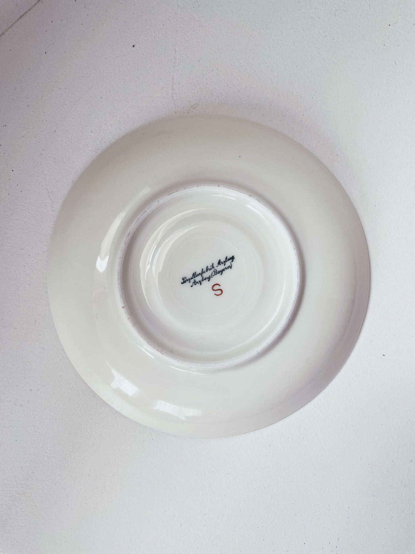 white and gold teacup