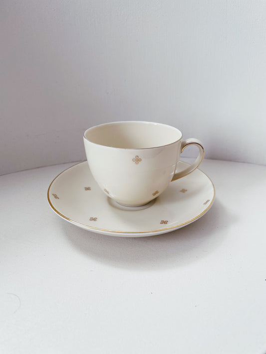 white and gold teacup
